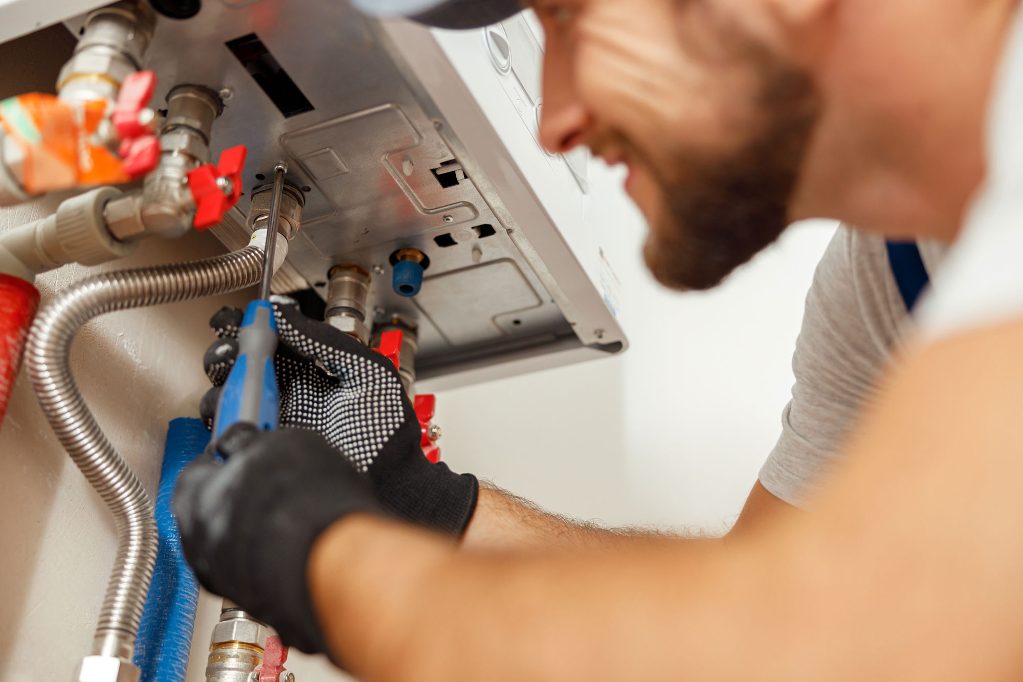 closeup-of-plumber-using-screwdriver-while-install-2022-03-09-03-07-35-utc